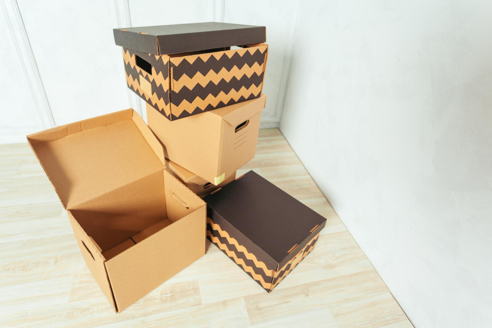 big cardboard boxes standing insinde room