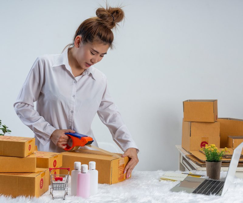 business woman is working online traing reply customer home office packaging wall